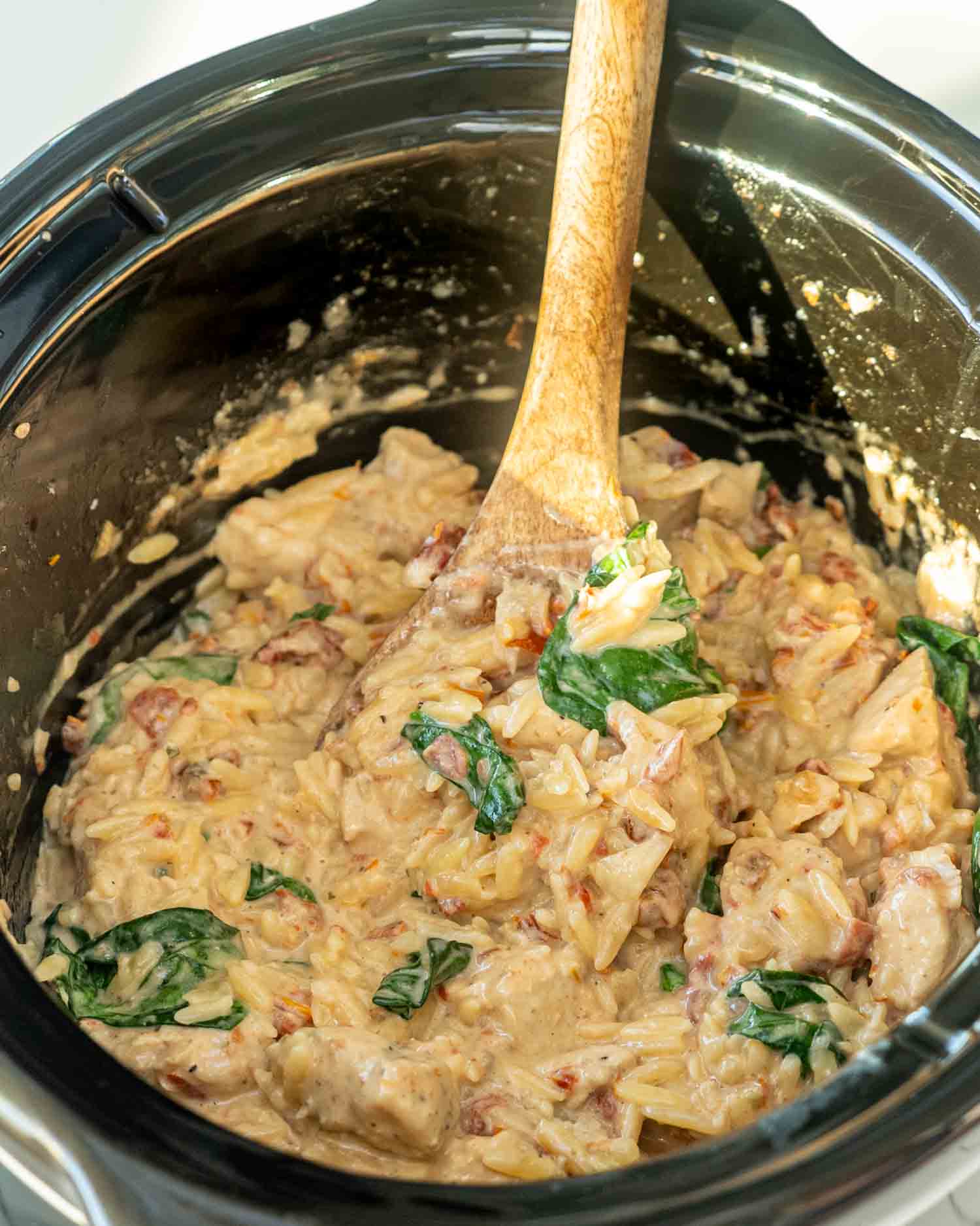 slow cooker creamy tuscan chicken orzo freshly made.