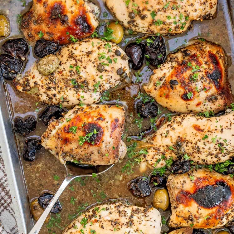 chicken marbella in a baking dish fresh out of the oven.