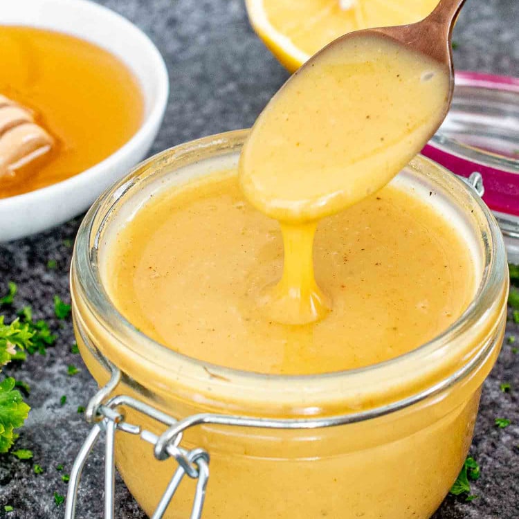 freshly made honey mustard sauce in a jar.