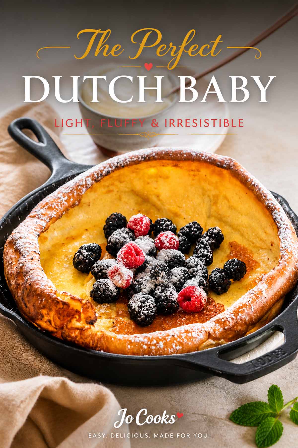 This light and airy Dutch baby pancake is baked in a hot skillet and topped with fresh summer berries.