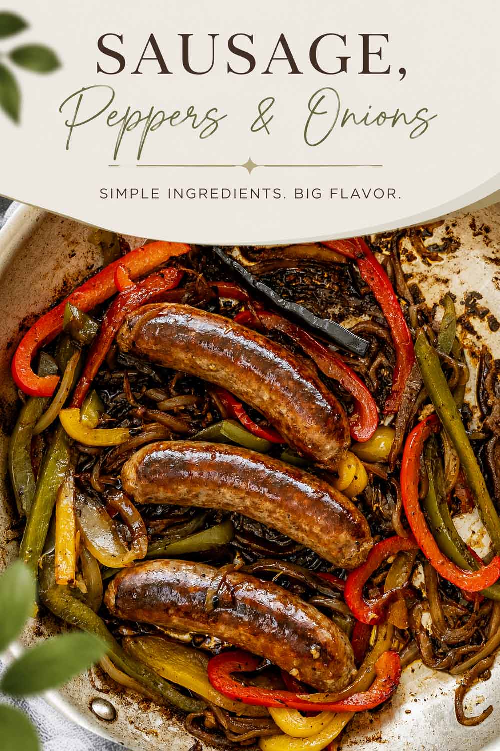 sausage peppers and onions in a skillet.