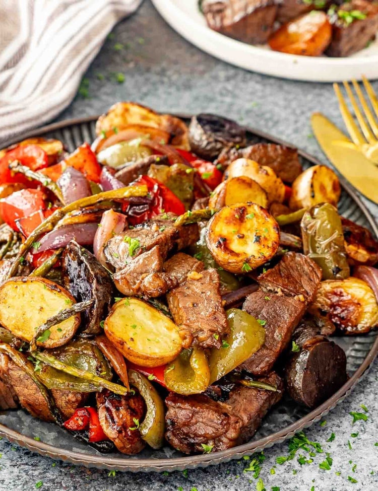 balsamic glazed steak tips and veggies sheet pan on a serving platter.