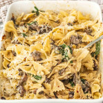 fresh out of the oven mushroom boursin pasta in a white casserole dish.
