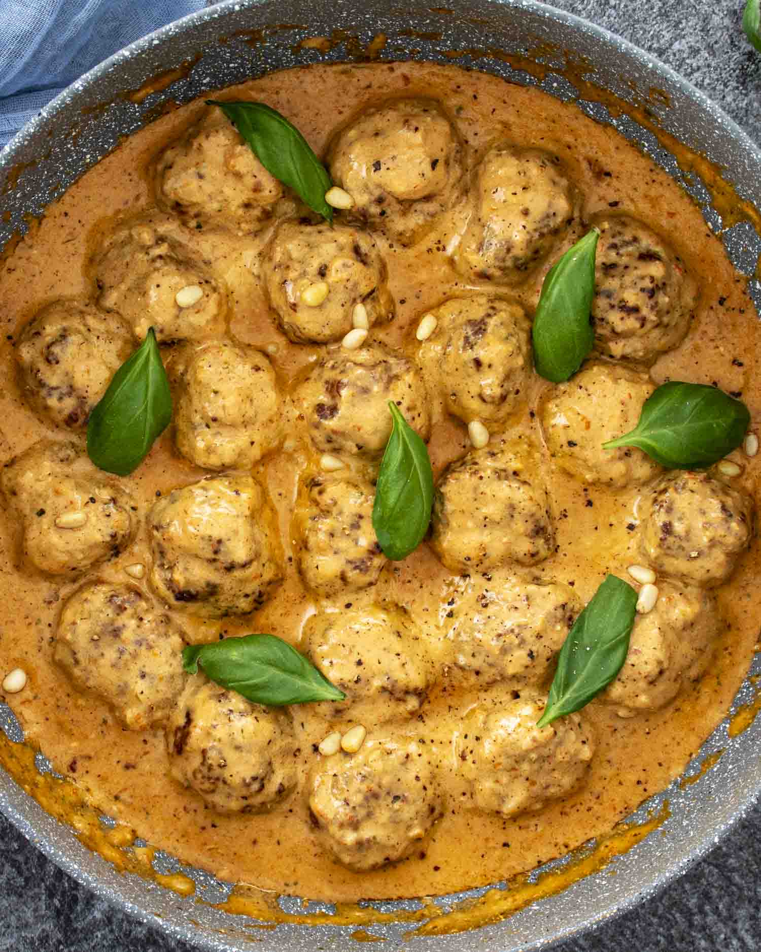 Pesto Meatballs in Creamy Sun-Dried Tomato Sauce