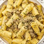 freshly made pesto beef pasta in a large white bowl.