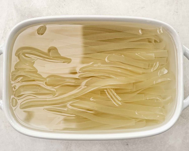 process shots showing how to make drunken noodles.