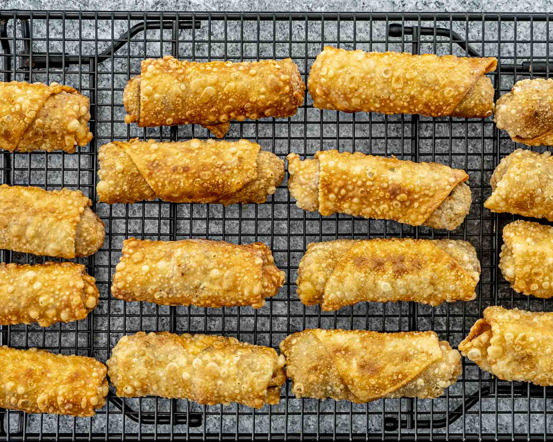 process shots showing how to make beef taco egg rolls.