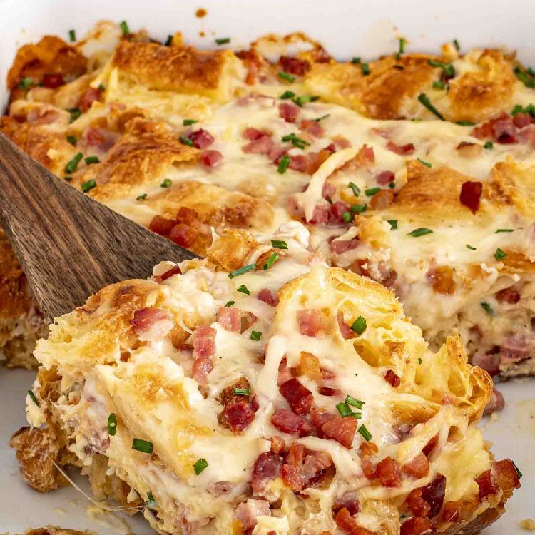 ham and cheese croissant egg bake in a casserole dish.