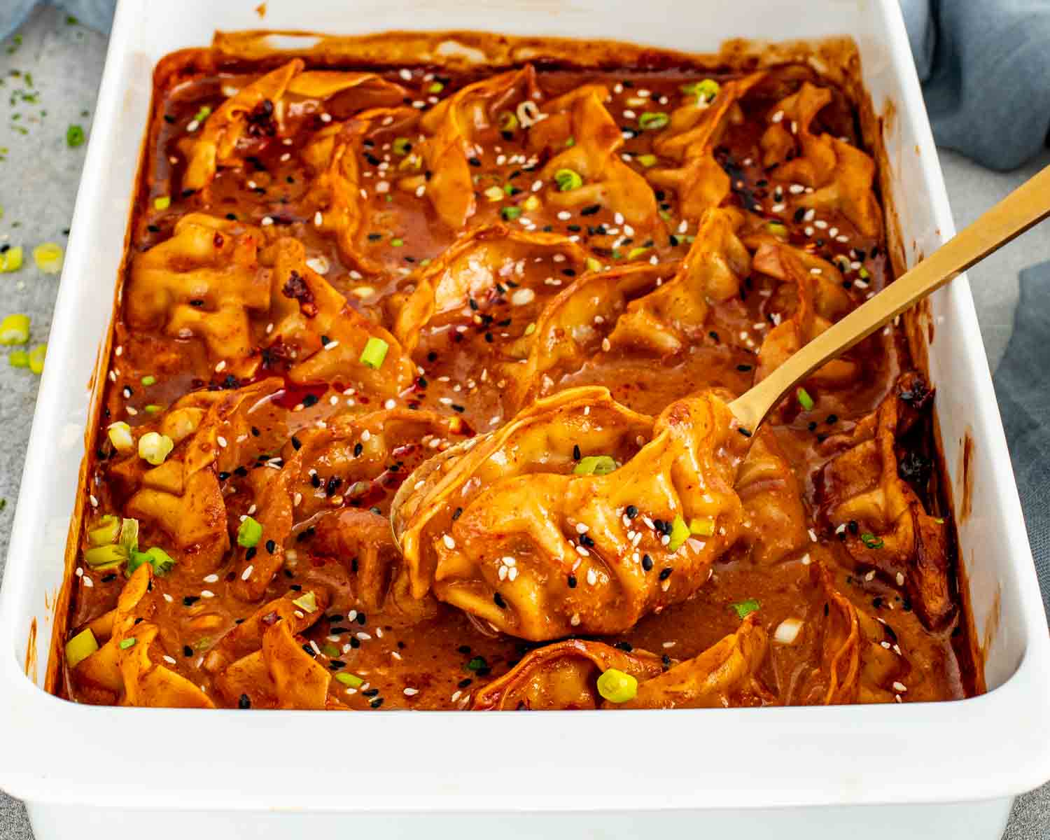 Creamy red curry dumplings baked in one pan with coconut milk and soy sauce.