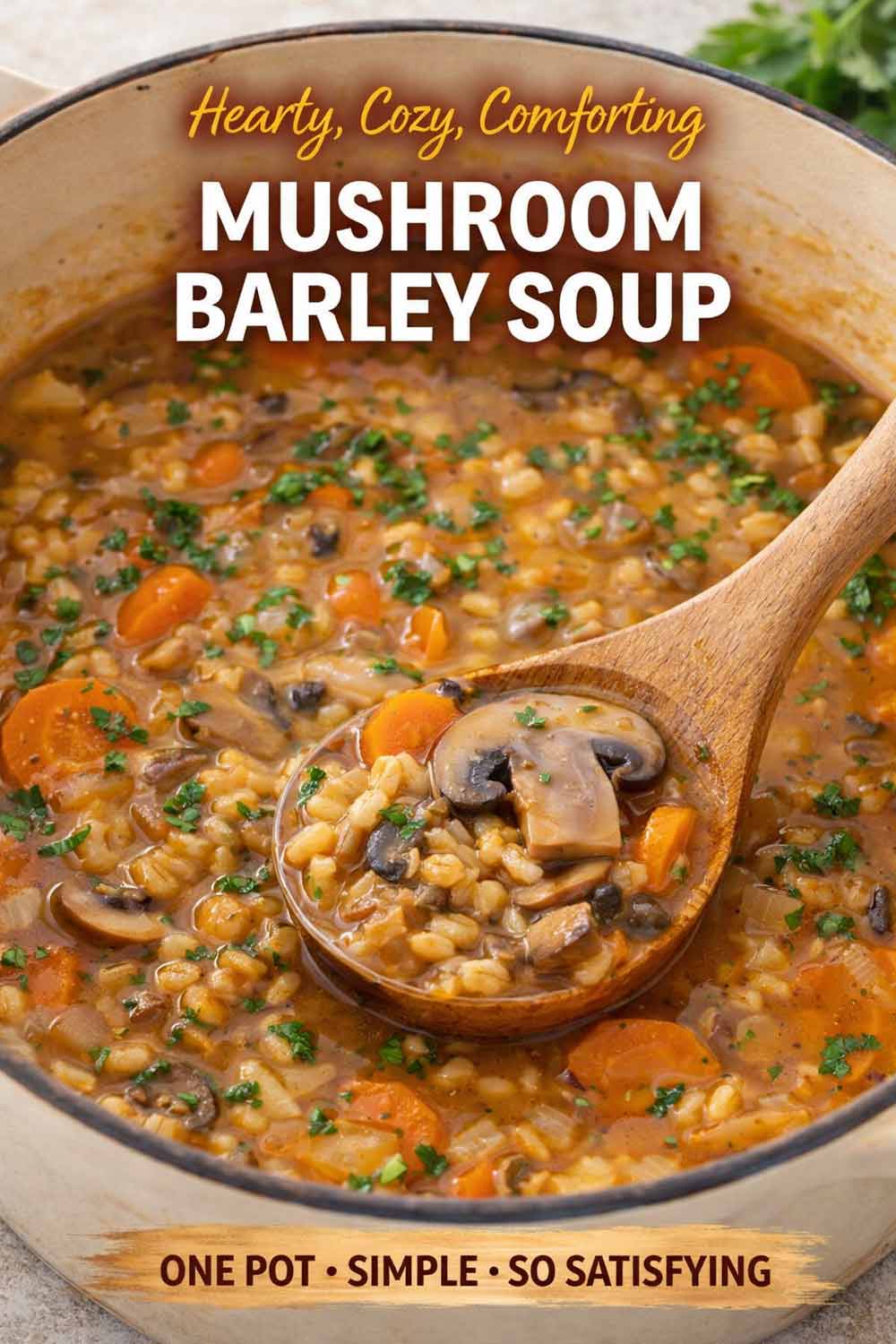 Mushroom barley soup simmering in a pot with ladle, packed with mushrooms, barley, carrots, and a thick flavorful broth.