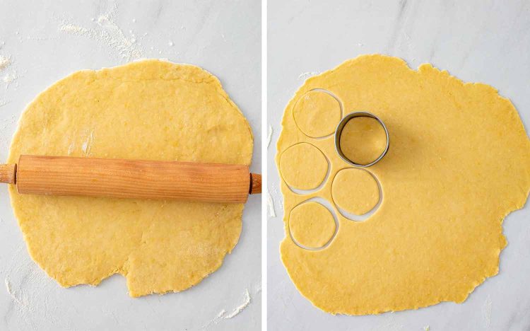 Homemade pierogi dough being rolled thin with a wooden rolling pin then circles being cut out with a round metal cutter.