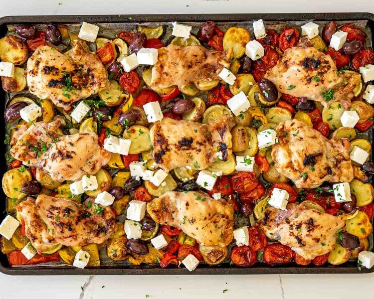 process shots showing how to make greek sheet pan chicken and veggies.