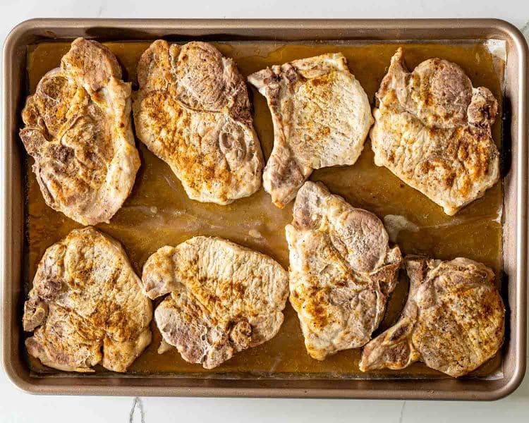 process shots showing how to make oven baked honey garlic pork chops.