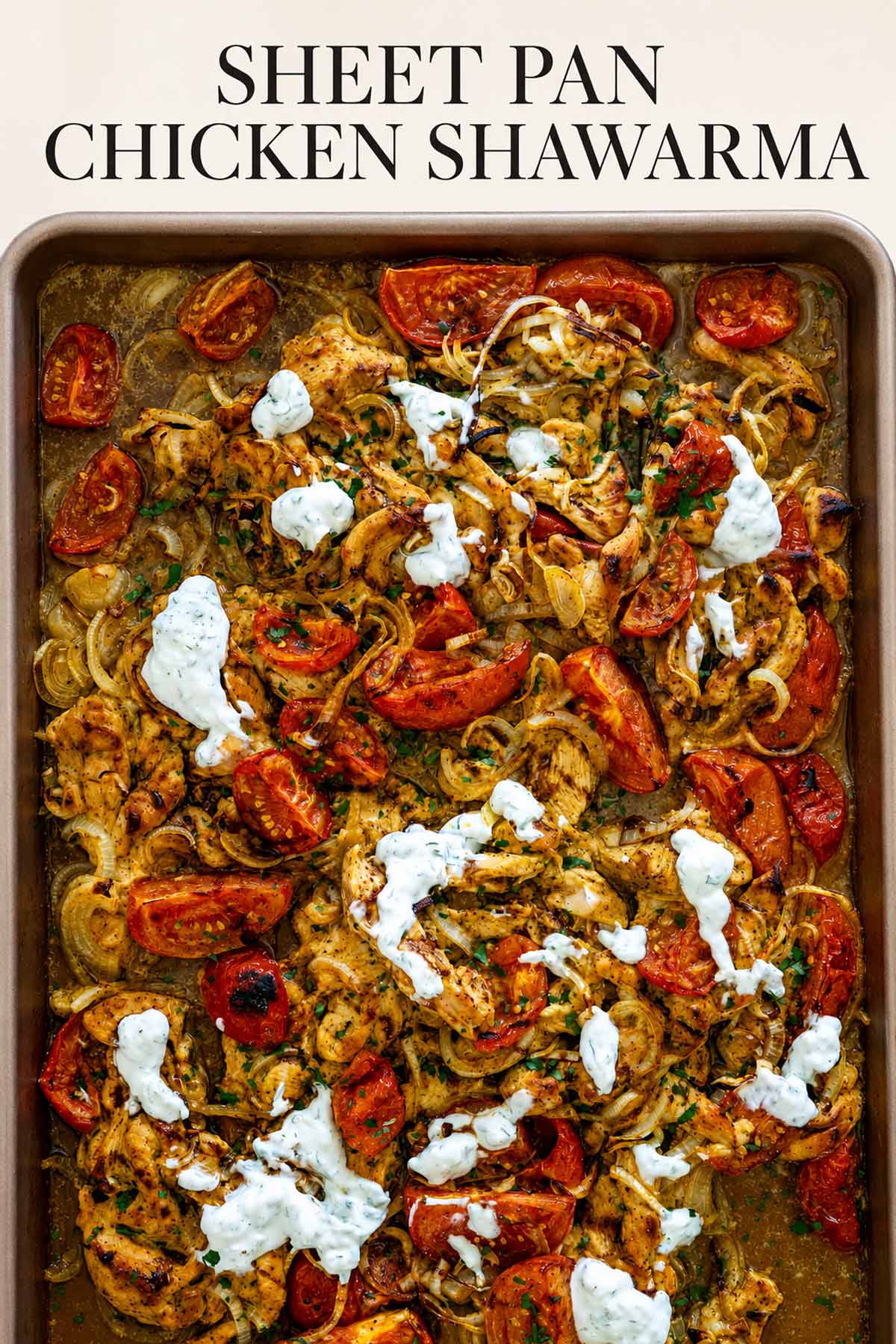 Pinterest graphic featuring sheet pan chicken shawarma with roasted tomatoes, onions, herbs, and creamy yogurt sauce drizzled over top.