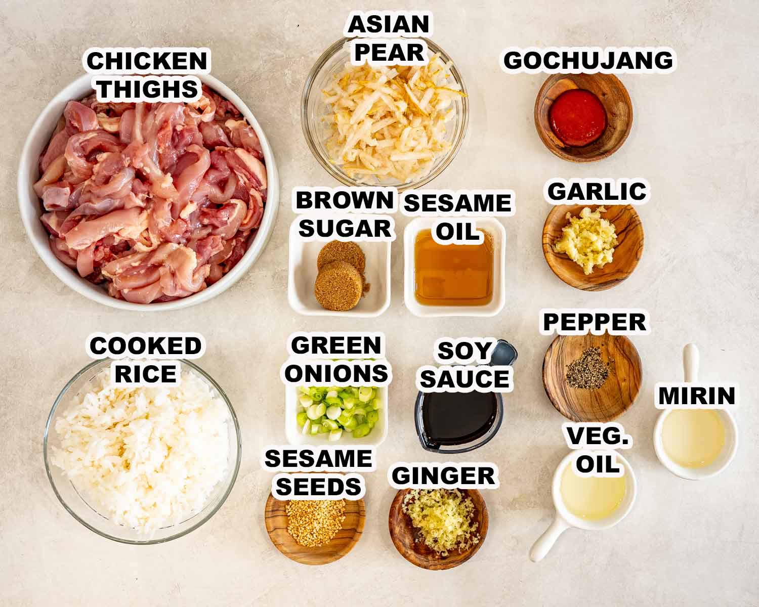 Labeled chicken bulgogi ingredients include chicken thighs, Asian pear, gochujang, aromatics, seasonings, rice, and garnishes arranged overhead.