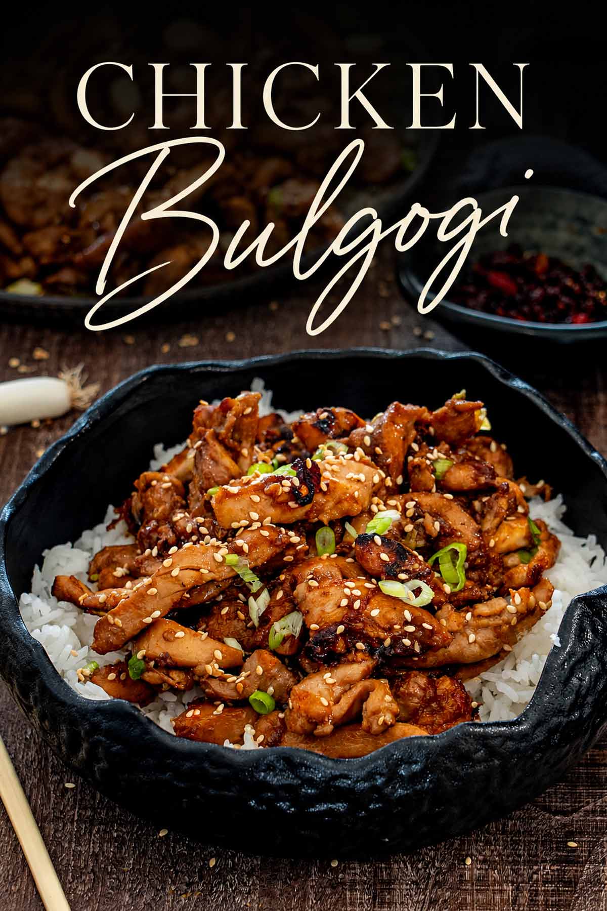Pinterest graphic featuring chicken bulgogi served over white rice in a skillet, topped with sesame seeds and green onions.
