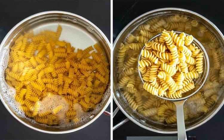 Rotini pasta boils in salted water before being lifted from the pot once perfectly cooked to al dente.
