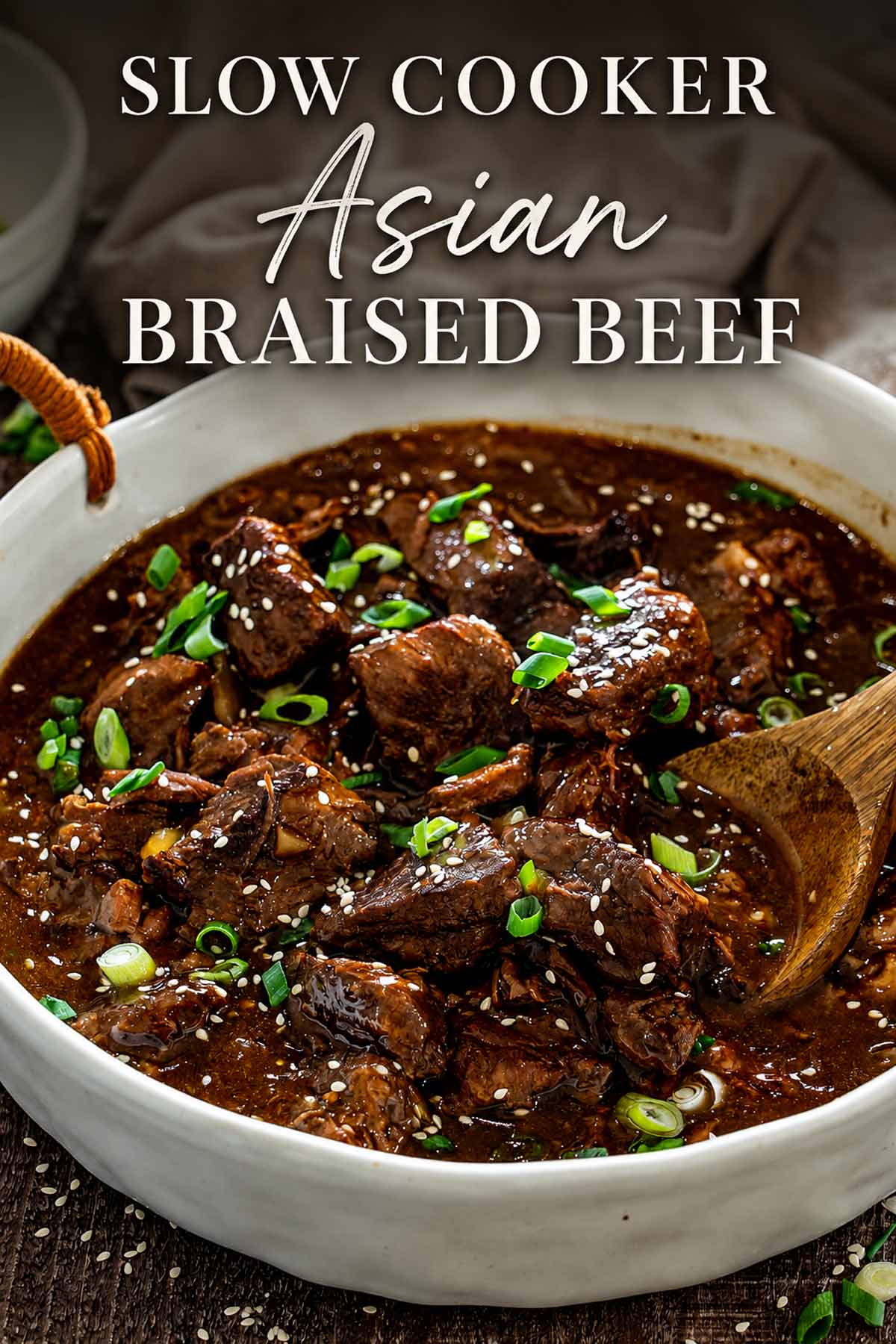 Pinterest graphic featuring slow cooker Asian braised beef with sesame seeds, green onions, and an elegant recipe title.